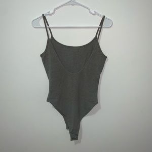 Grey body suit with open back
